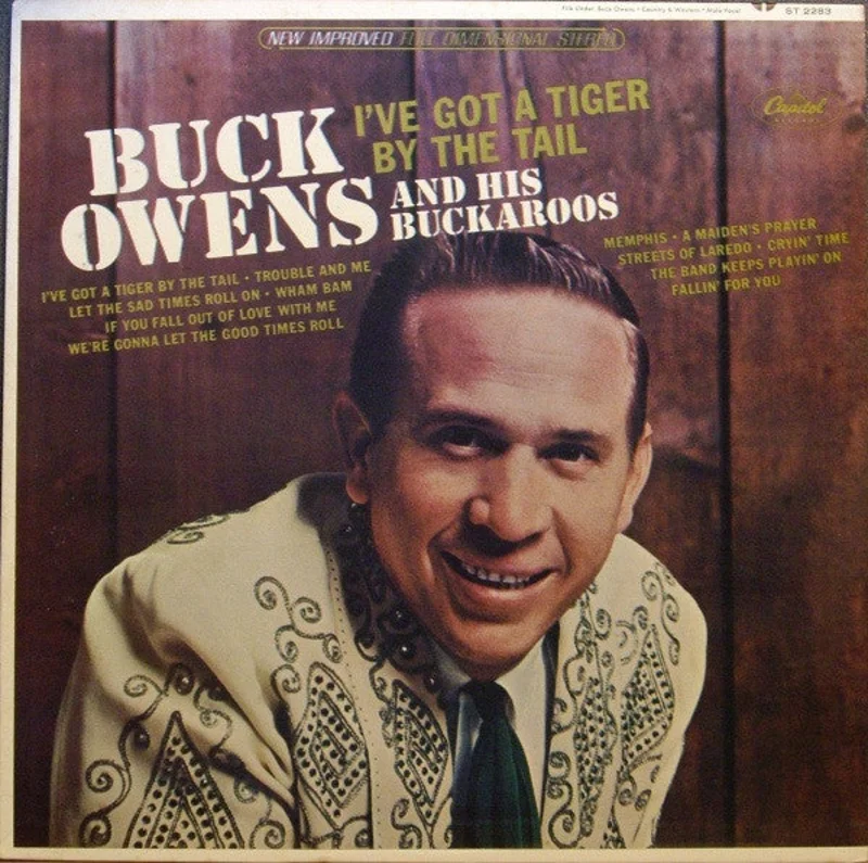 Buck Owens And His Buckaroos - I've Got A Tiger By The Tail